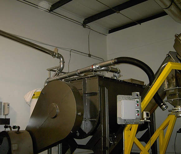 Ductwork for food processing dust installed in a manufacturing plant.