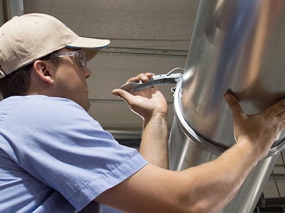 A Technician shown installing a Nordfab Ducting system.