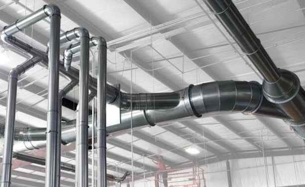 Nordfab ducting installed in an industrial facility to control cutting fluid mist.
