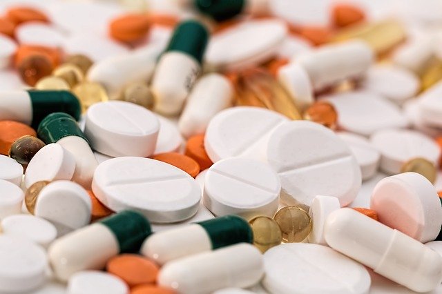 Pharmaceutical drugs laid out on a counter.