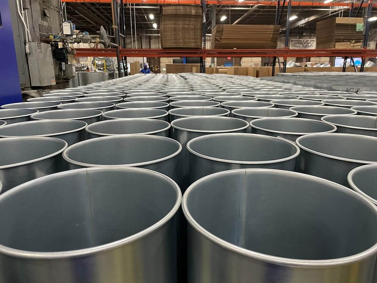 Nordfab Ducting pipe in stock shown in a warehouse.