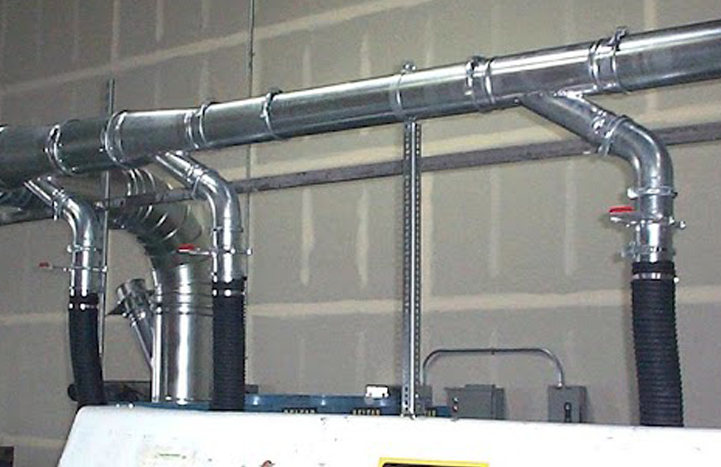 Nordfab dust collector pipe shown installed on industrial machinery.