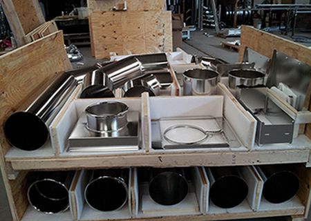 Stainless steel ducting stored in wooden crates