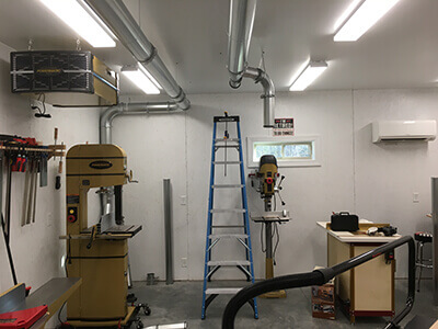 Nordfab quick fit ducting installed in a home wood shop.